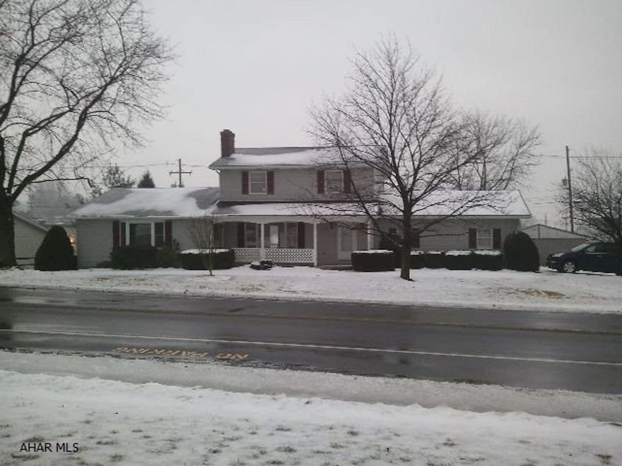 This home qualifies for a Rural Housing Loan. That means you can buy this home with no money down. Plus, you can finance your closing costs. Contact listing agent for details. Have someone living with you who would like to have their own space? This home has a first-floor addition that includes  a living room, a bedroom, a full bathroom, and a private entrance. Great back deck. Oversized 24'x24' garage and a 12'x24' shed. Seller will give buyer a $10,000 credit at closing for improvements. Per Roaring Spring Borough, approval would be needed for commercial use.