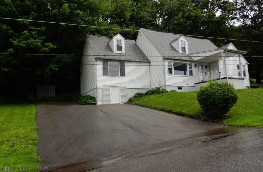 Spacious rooms throughout. Big living room w/ fireplace, french doors to the bedroom. Nicely paved driveway. A great view of town.