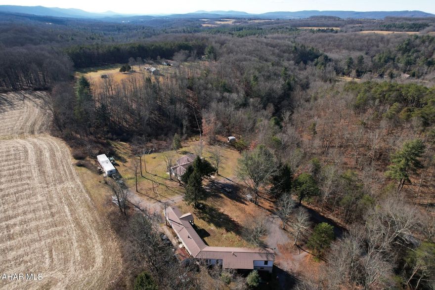 Incredible 4+ acres property boasting four dwelling units, private utilities, and breathtaking mountain views. This secluded haven offers unparalleled privacy, surrounded by nature and proximity to game lands. Conveniently located near Maryland, it presents an opportunity for both residential use and investment. 
Ideal for those seeking a tranquil retreat, this expansive parcel allows for various possibilities.
This property stands as a versatile investment, offering the potential to build your own dream retreat or capitalize on its income possibilities. Seize the chance to own a slice of tranquility and opportunity in this expansive and picturesque landscape.