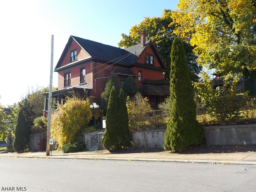 Great view of downtown Altoona.  A very cool 2.5 story brick house with 3 BR & 1.5 bath, & two kitchens.  4 year old roof & furnace.  Pine floors  6 city lots/.42 ac.  Parking in alley. New water lines 3 years ago. Vacant lot is 120 x 100.  Lot with the house is 120 x 50.
