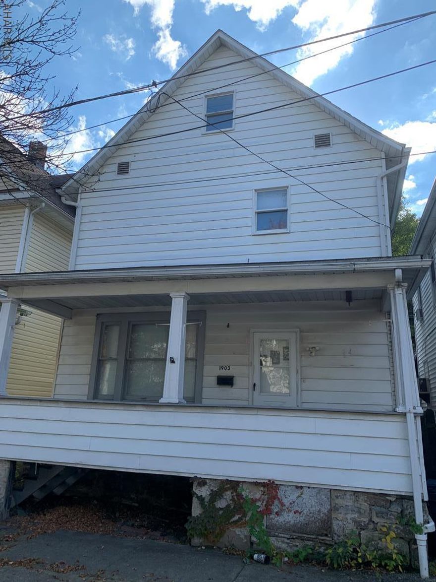 Investor Special or PERFECT starter home! Stop renting & make an offer!  Great space, mechanics, and structurally sound. This home offers hardwood flooring throughout the large living room, dining room, and foyer.  The upstairs offers three bedrooms and a nice sized bathroom.  Two additional large rooms on the third floor with many possibilities! A must see - call to schedule an appointment.