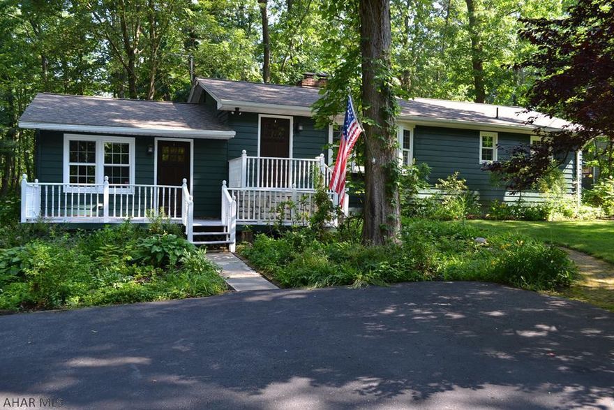 Beautiful ranch: 3 bedroom, 2 bath house in Lower Brush Mountain. Private secluded yard with almost 3/4 acre. Sit back on the porches and relax to the sound of nature right in the middle of Hollidaysburg! Updated with beautiful on suite master with its own entrance to the back covered patio. Charm and beauty await you in the large sunk in family room with stone fireplace.  Enjoy the view of the large front yard through the window of the living room with a second brick fireplace. Don't wait, this one won't last! You don't find this kind of privacy in Hollidaysburg often.