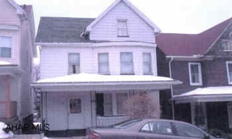 2 1/2 story aluminum sided home. Aluminum siding, comp shingle roof, off street parking, .5 bath in basement, 100 AMP electric.