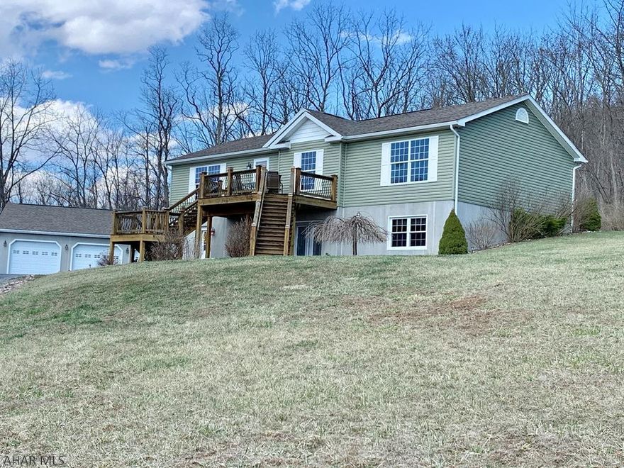 Immaculate HOME on 4 acres with Spectacular Mountain Views of Bedford Valley!  Home Warranty Included! Spacious 3 BD, 3 BA open living, dining and kitchen. 2352 sqft of Living space features a beautiful stone gas fireplace an modern accent windows on each side. The kitchen features lg. island w/seating, Custom Kraft walnut cabinetry, pantry, built-in electronic charging station and stainless steel appliances. The master suite features his/her sinks,separate shower a garden tub, private water closet and a lg. walk-in closet. The open 784 sqft  recreational/entertainment room has custom pine walls, recess lighting, full bath and a dog room/storage area and 784 sqft integral garage.  Lg.3 bay 1140 sqft garage w/electric and 21x20 storage shed. Beautifully landscape and plenty wildlife.