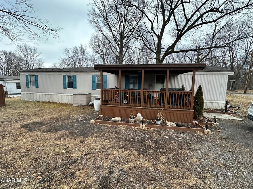 Logan Township offers this 3 bedroom manufactured home located in the Hill Crest Communities. Built in 1998, this home has a covered front porch and large shed. The interior has several updates including newer laminate flooring, lite grey painted kitchen cabinets and an updated full bath. Lot rent in $448.00 per month includes water and sewer, trash removal. Roof was recoated in 2024. Interior photos will be added next week, once seller vacates.
