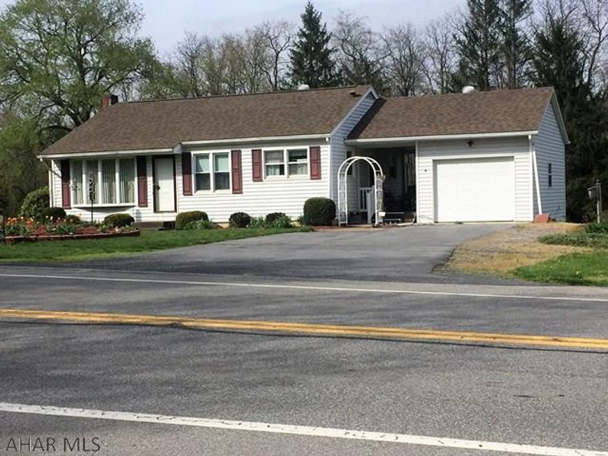 This is a very well maintained property just minutes from Bedford in the village of Wolfsburg.  It is a solid 2 bedroom house with breezeway and garage.  The house is nicely landscaped and  includes the lot beside which gives you plenty of room for gardening and play.  There is a small stream at the rear of the lot with an area that was recently used for family picnics complete with an outside fireplace. This is a great home perfect for a small family or a retired couple.