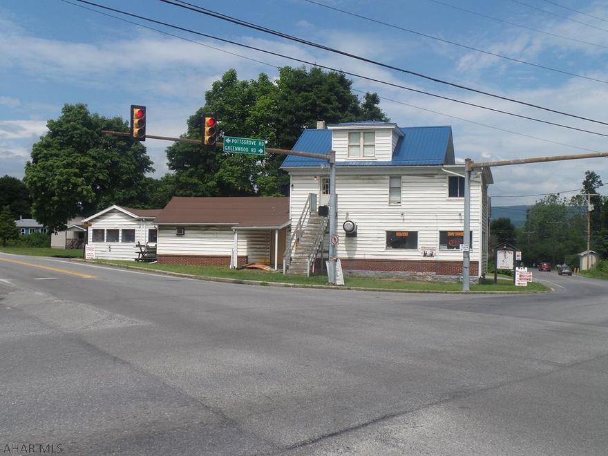 Logan Township High visibility and traffic on the corner of Greenwood Road and Rt. 764!  This multi-unit property has many income possibilities with a little TLC.  Main part of building has new metal roof.  Commercial unit and 1 large apartment.  There is ample parking.  This sale will include 41 other properties at a sales price of $3,250,000.  Please see attached list of additional properties.  Seller will not consider selling off properties separately.  Sale is AS-IS WHERE-IS and seller is making no representations of condition.