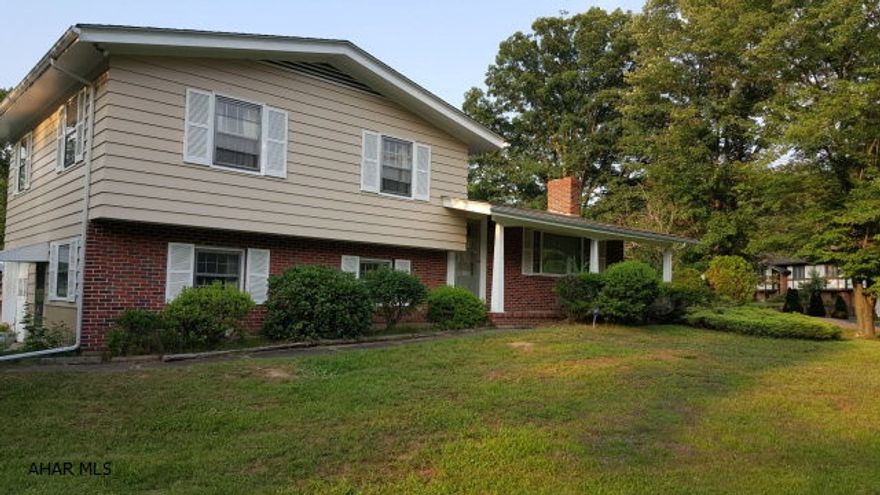 Great property, great price in Hollidaysburg!  Located just off Brush Mountain Road, this property features 3 spacious bedrooms, with one and a half baths.  This property features an open kitchen/dining area, large living room with brick wood burning fireplace.  The floors are all original hardwood and there is a bonus room off the kitchen with half bath that could possibly be used as a 4th bedroom or recreation room.  The main bathroom has recently been tiled.  The property features an attached one care garage.  The home is located in a quiet neighborhood, and sits on a very nice corner lot.  This home has a lot of great features not found in other homes.  Don't wait, you will be too late- This property is priced to sell!