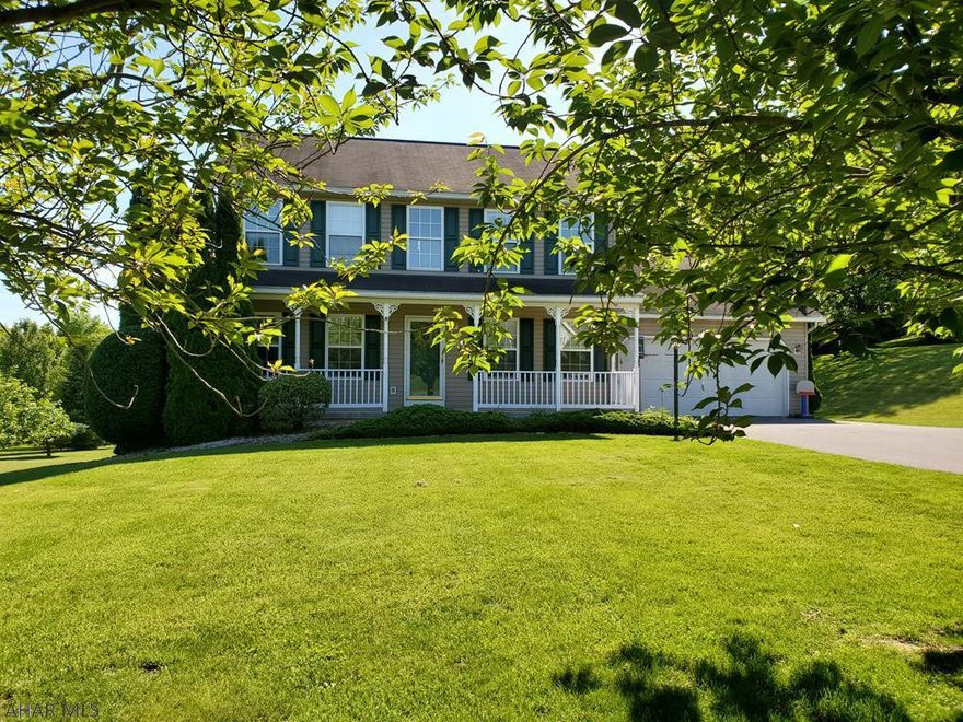 Beautifully maintained vinyl sided 2 story energy efficient landscaped home on a quiet street in Juniata Mills with 2 car garage.  Professional cleaned carpets, tile and hardwood flooring, thermal windows with central air and propane fireplace.  3 Bedroom 2.5 Bathrooms.  Master BR with Master BA with double sink and custom shower, large walk in closet and pull down steps to attic storage.  Modern kitchen with included appliances.  Crown molding throughout.  Partially finished basement that is carpeted and has walk out access.  Home has pex tubing, water treatment system and new trane furnace w/heat pump.  Also included with this home is a beautiful block patio with built in fire pit to enjoy the lovely mostly flat back yard.