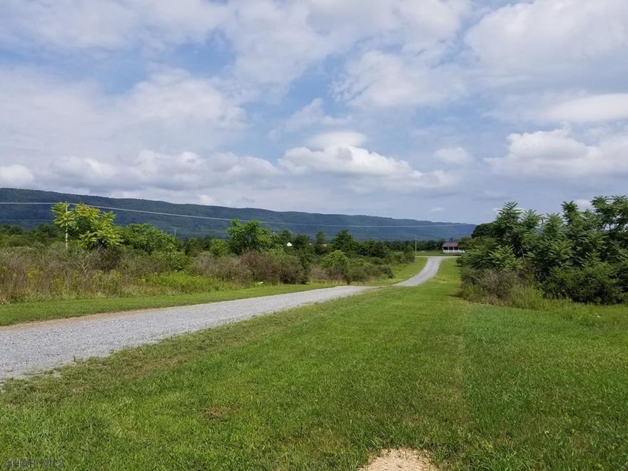 THIS IS A 6 ACRE PARCEL WOULD BE GREAT FOR LIVE STOCK, HORSE ETC.  INCLUDES  WELL AND DRIVEWAY TO BUILDING SITE.