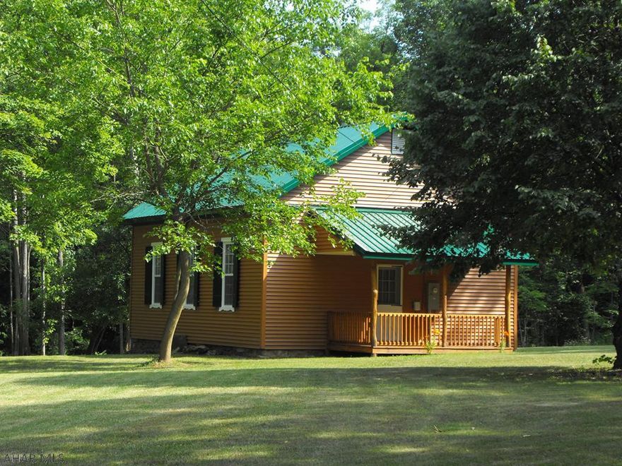 Ready for a new owner, this newly done over former "Schoolhouse" is an affordable vacation or permanent home! This home boasts a newer metal roof , new windows, floors, appliances and new vinyl siding. It features an open concept lay-out with two bedrooms and a wood stove to keep you warm on chilly nights. Enjoy life by the largest lake that's entirely in Pa. The lake is full of Striped Bass, Rainbow Trout, Yellow Perch, Bluegill and more! Just a couple miles from Tatman Run Beach & Launch and State Game Lands too! Fresh air, boating and fishing! What a find! Inside pictures in a few days
