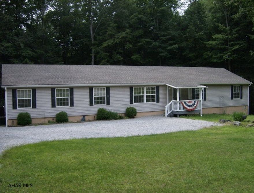 2007 Doublewide on a foundation (2000 sq ft.), 13 X 28 Master BR suite, kitchen with island,& appliances,FR with fireplace.  Master BR suite with bath, plus 3 MORE BRs.,and another full bath. Enjoy your view of the woods from the large rear deck. Located in Glendale Yearound which has its own heated pool, tennis and basketball courts. Close to hunting and fishing. Near Rock Run Recreation Area. Would make a fantastic yearound home or a great vacation home.