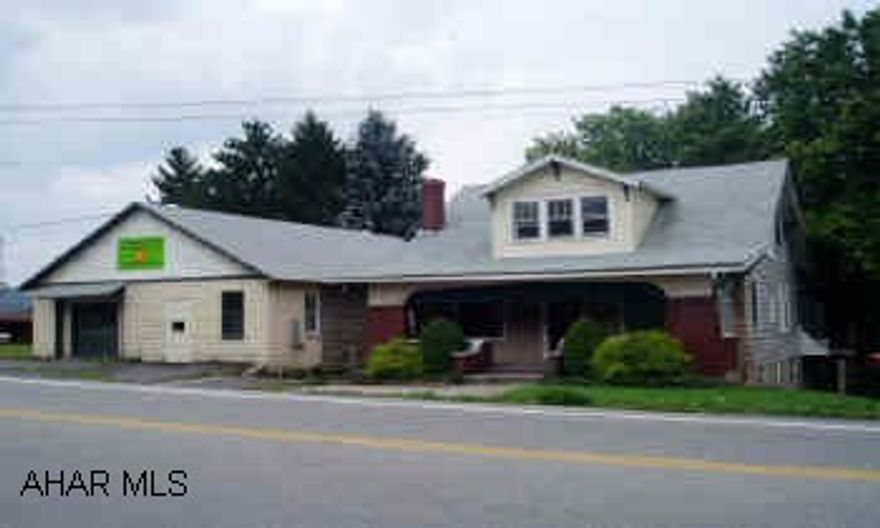 1.5 story Frame 4 bedroom 2 1/2 bath with full walk-out basement, sun room, hardwood floors, public water and sewer. Concrete block garage 1525 sq. ft. with commercial value.