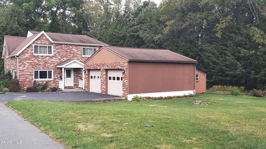 Welcome to this peaceful retreat in Portage SD! This charming brick home has it all! Comfort, Space and functionality, both inside and out. The well-maintained exterior features a 2-car garage complete with an office space, concrete flooring, and door openers. Perfect for work or hobby space. A large wooden shed in the backyard offers ample room for outdoor tools, seasonal items and the pool equipment.Step out onto the spacious back deck, ideal for BBQs, gatherings or summer pool parties. The serene, tree-lined backyard adds privacy and tranquility, and the vegetable garden is ready for next season. Follow the sidewalk to a welcoming covered porch that invites you into the home. Inside you'll find a great layout featuring a 3/4 bath combined with the laundry area, a beautifully updated kitchen with Armstrong flooring, 42'' cabinets and durable Corian countertops. All the appliances are included. A bright and inviting dining room and living room with large windows that flood the space with natural light. A second updated full bath is also on the main level. Upstairs offers three generously sized bedrooms and a versatile bonus room. Perfect for a home office, playroom or guest space. Each room offers ample closet space and continues the theme of natural light and comfort. This property is being sold with an additional 40x82 side lot that must be sold with this home that would offer extra yard space. Don't miss out on this move in ready gem in a peaceful setting! Call for your private tour today! With the next door lot being sold with this property, the total price would be 160,000.00