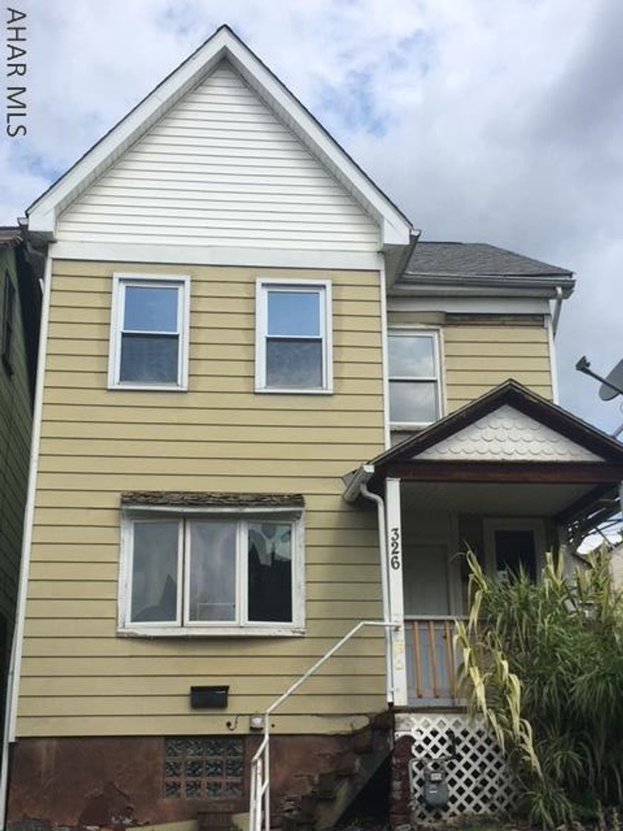 Cozy 4 bedroom, 1 bath house with covered front and back porches.