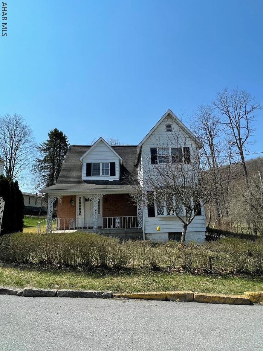 This charming house in Cassandra Borough has had many cool modern updates throughout.  The curved staircase is one of many focal points in the living room, which is large enough for all the family activities.  Bright dining room that connects into a room that could be used as a home office.  Both the half bath on the first floor and the full bath on the second floor have been renovated.  The hardwood floors have been refinished, all new light fixtures throughout, including modern ceiling fans in the bedrooms.  Kitchen has newer appliances and a pantry.  The new deck is great for grilling!  Plenty of closet space. Large unfinished room in the basement could be additional family living space for entertaining.