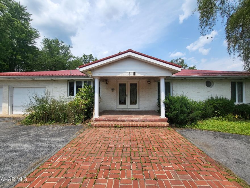 Unpolished diamond!  This brick 3BR, 2.5BA home features an updated kitchen, sunken living room, and large bedrooms.  Sunroom, inground pool, gazebo, and koi pond. This home will require renovation and updates, but a great location.