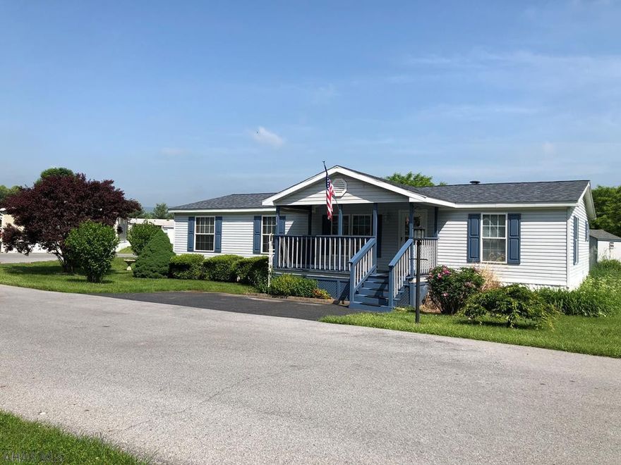 Spacious and well maintained three bedroom, 2 bathroom home. Enter into the large living room with high vaulted ceilings. Your eyes will instantly be drawn to the large wood burning stone fireplace. This home features an eat in kitchen area and laundry right off of the kitchen. The master bedroom features a luxurious ensuite with a large soaker tub, a standing shower, his and her sinks and two large walk in closets. Two other bedrooms and a half bath and plenty of sky lights complete the home. Enjoy the front and back covered decks. New roof was recently installed. Lot rent is $392 per month and their portion of water/sewer is included into the bill. HOA fee covers lot rent, garbage and snow removal.