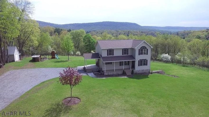 Stunning 3 bedroom, 2.5 bath home on approx. 7+ acres in a private setting with spectacular panoramic views. Custom built home that is immaculately kept. Custom kitchen with large island, open concept kitchen/dining, 2 story sunroom, large living room, 1/2 bath, and large laundry/mud room all on the first floor. 3 large bedrooms on the second level. The master bedroom has a spacious en-suite bathroom and walk-in closet. Walkout finished basement includes a large rec room with bar, utility room and lots of storage. An absolutely stunning home ready for you!