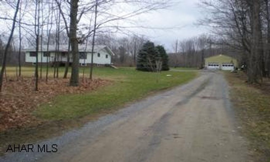 Ranch home on 8 wooded acres. Detached 2 car garage. Nice country location