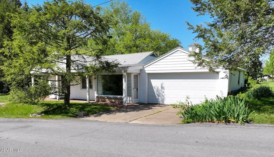 Classic rancher on half acre in desirable Summit area of Everett. This sizeable ranch home makes one floor living a breeze with 3 bedrooms and 1.5 baths. Boasting over 2000 square feet of living space this would make a great family home in a friendly neighborhood. This well loved home features a galley kitchen with cherry cabinets, pantry area, breakfast nook, built-in range, dishwasher and newer refrigerator will be included. Large living area with tons of natural light thanks to the large bay window. Working wood fireplace. Formal dining room is open to living area. Bonus room could make a nice main floor laundry area, sitting room or play room. Spacious primary bedroom with double closets. Breezeway/bonus room could be den, office, rec room etc. Lots of options for this space! Two car attached garage. Original hardwood floors throughout, new hot water radiant heating system and newer shingle roof. Basement has laundry, shower and tons of space! Could be finished. Yard is a half acre with lush landscaping and a prime location. Make this sweet corner lot your own. This home has been a central part of this family's memories for decades and is now looking for it's new chapter. Call listing agent for a  personal showing or more information today!