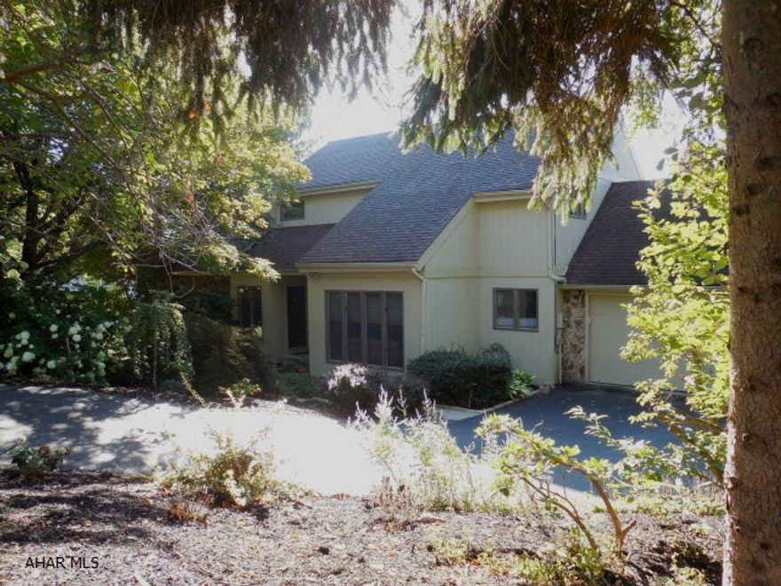 This lovely contemporary home is nestled on a beautiful wooded landscaped lot in Altoona. With 4 bedrooms plus a bonus room on the second floor. Spacious open floor plan. The Master suite is located on the first floor. Conveniently located first floor laundry and powder room. An over-sized deck, with remote control electric awning, overlooks the in-ground heated pool with a pool house.  Totally finished day light basement with access to a covered patio with unique pavers and pool path. Attached 2 car garage with attic storage above with pull down steps.  An additional beautiful wooded side lot 100'x 150' is included. Taxes for lot included.