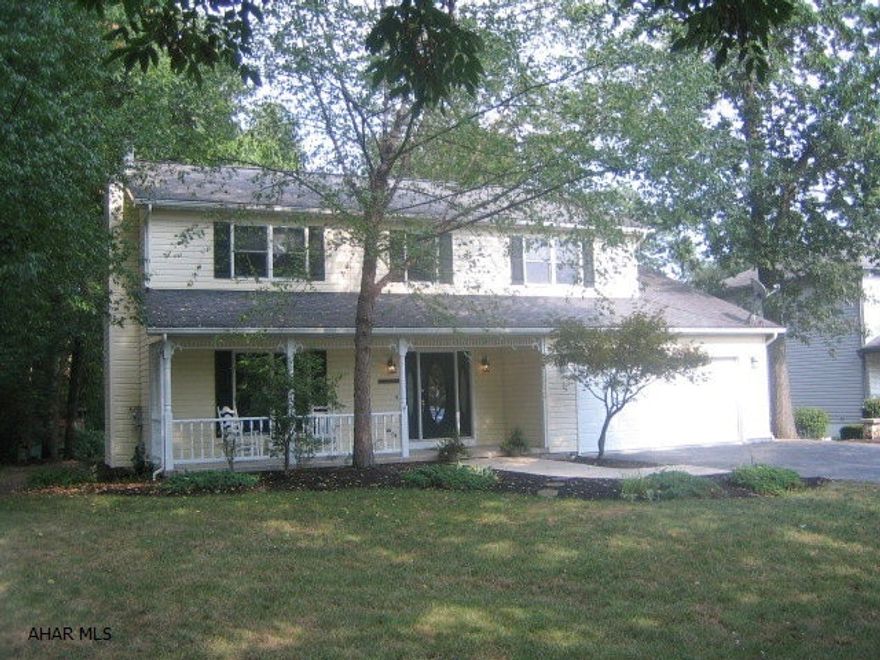 FANTASTIC HOLLIDAYSBURG HOME with large, wooded lot. One year home warranty! New carpeting and freshly painted throughout. Beautifully remodeled eat-in kitchen with center island, dining area and adjoining great room. Living room with gas FP, formal dining room, master bedroom suite with walk-in closet, and finished basement with family room and posh office. Relaxing front porch, large rear deck, 2 car attached garage with openers. 4th bedroom adjoins master suite.