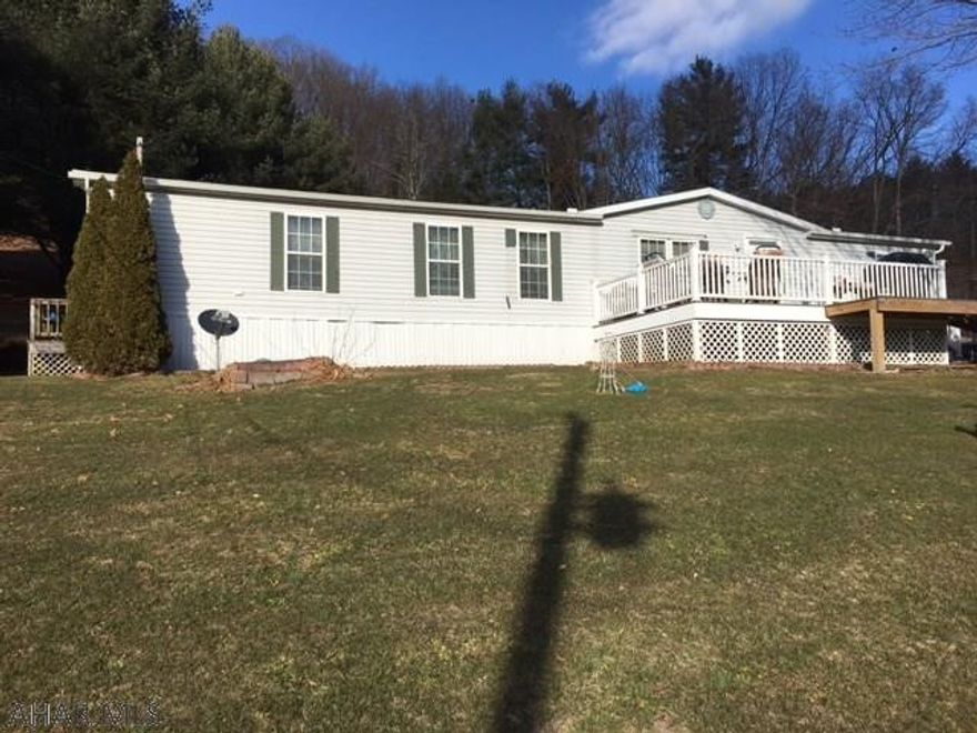5 miles from Downtown Bedford.  Enjoy the country setting!  This double wide has a master bedroom with 3 additional bedrooms.  Large living area when entering into the house for entertaining.  A beautiful front deck to take in all the views.