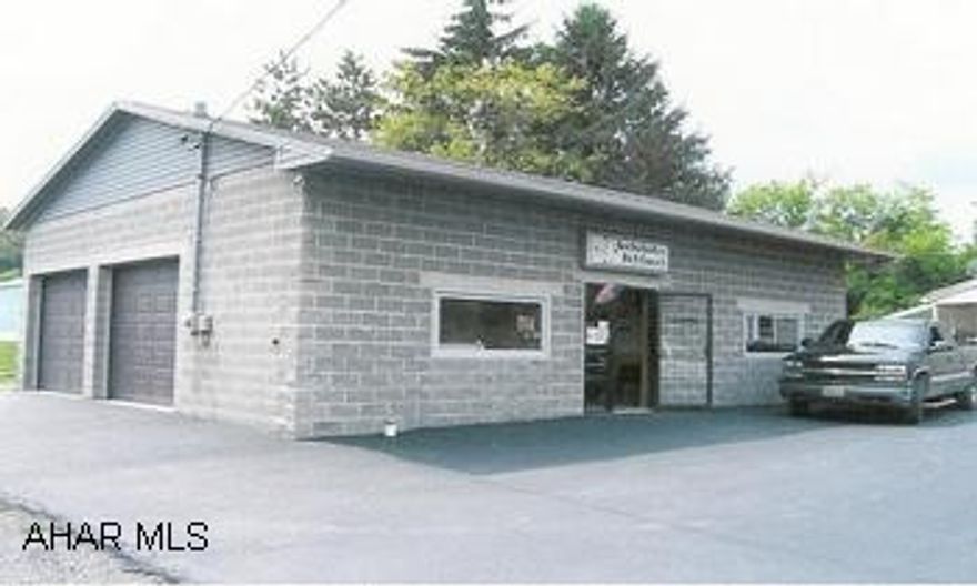 1200 sq. foot block buulding built in 2002. Includes two offices, kitchen, bathroom, and 2 bay garage. Ideal for professional office or small sales facility. Call Randy for details.