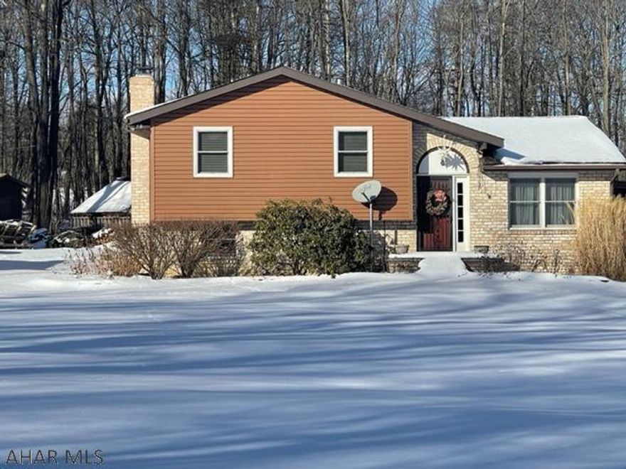 Awesome multi-level, 3 BR, 2 BA home on 4.3 acres; in the country but only 7 miles from Altoona. Home boasts den, kitchen, living room, dining room, sunroom and finished basement. Also has 20X40 inground pool, w/pool shed as well as 28X34 garage, 16X16 - 2 door equipment shed, livestock pen, smoke house, and firewood covered storage. Also has 20kw whole house generator. This is a must see property. Call agent for more details.