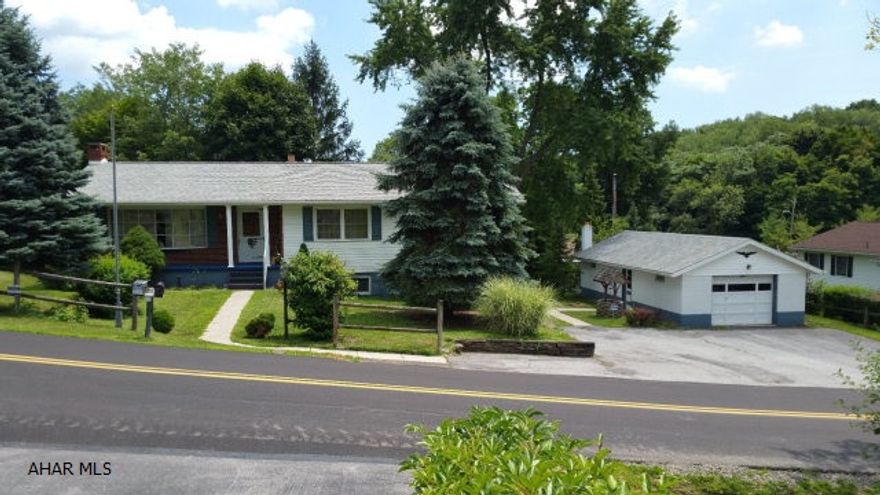 A terrific property with amazing potential!  This 4 BR, 2 Bath can't be missed. Includes an oversized finished basement with a 2 car garage, very pretty backyard, front and back porches with the back porch being screened in.  The black top driveway allows for an abundance of off street parking.