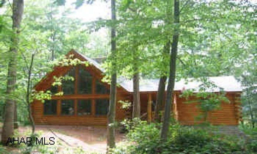 One of a kind all Log home. See through stone FP, flagstone & hardwood floors, loft screened porch. Seculded 2.45 acre sitting. Call Carol w/ questions. Property sold "as is". Subject to bankruptcy approval. One of a kind all Log home. See through stone FP, flagstone & hardwood floors, loft screened porch. Seculded 2.45 acre sitting. Call Carol w/ questions. Property sold "as is". Subject to bankruptcy approval.