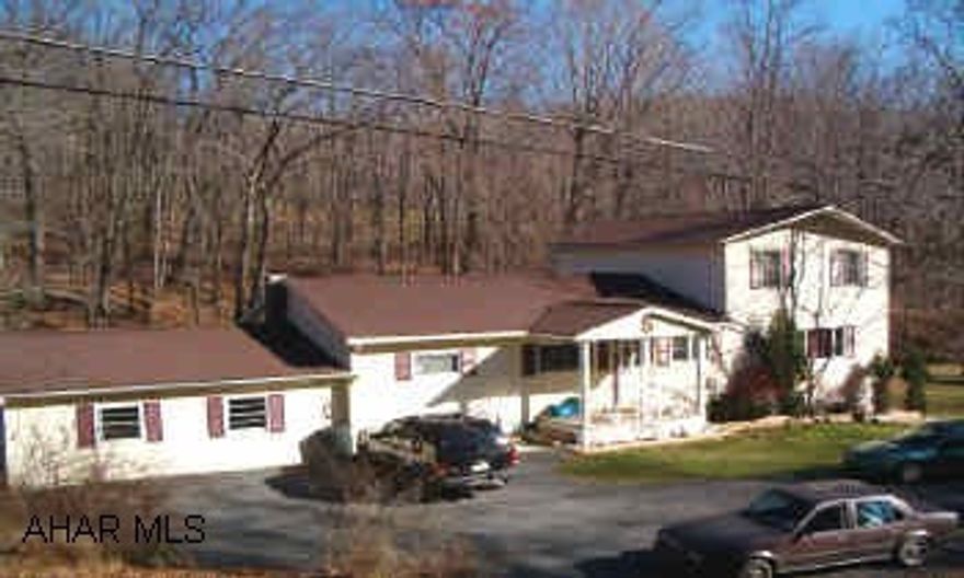 4 BR, 2.5 BA on over 1/2 acre with stream, oak kitchen, master suite with walk-in closet and bath, country setting, 3 zoned hot water oil heat and domestic hot water oil, new well pump.