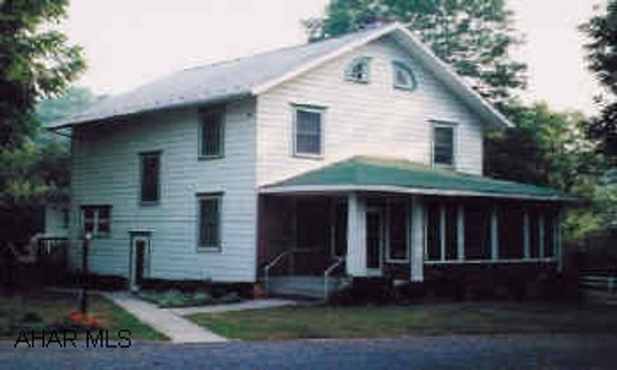 2 story frame house on 10 acres. 5 outbuildings, including garage and 2 barns.