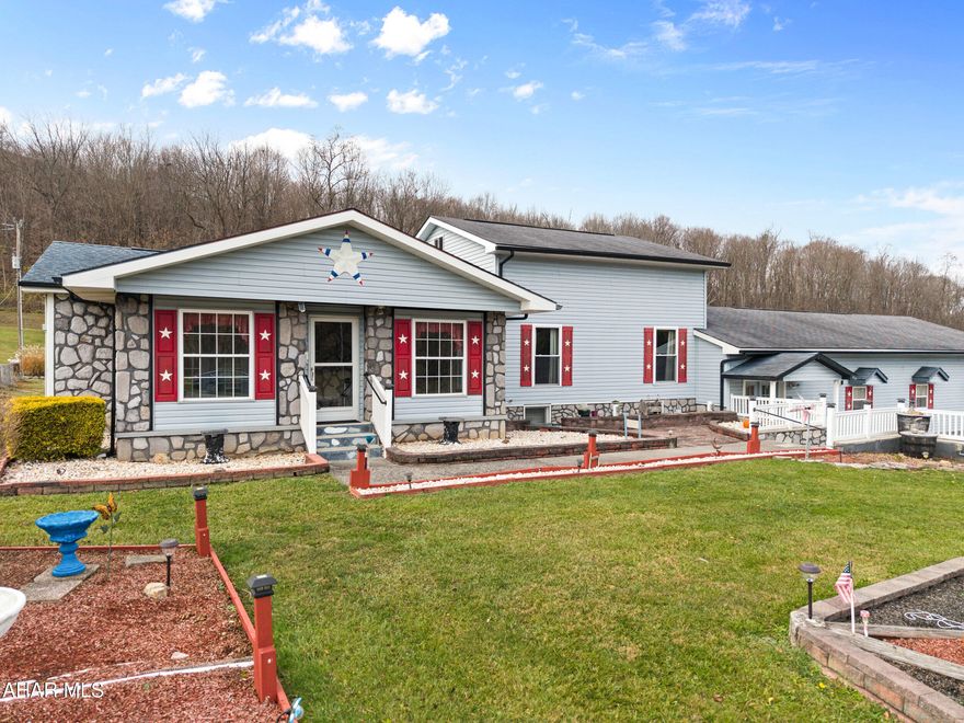 Charming One-Story Vinyl Home on nearly 1 Acre in Hopewell! Discover the perfect blend of comfort and functionality in this spacious one-floor living home, set on a serene, level lot. Inside, you'll find a bright and inviting living room complete with an electric fireplace, a beautifully designed kitchen featuring a dining peninsula, and a cozy dining area—perfect for entertaining or family meals. A dedicated laundry room and a spacious walk-in pantry offer added convenience. Huge master bedroom and an elegant main bathroom with a step-in shower, while the second bedroom, adorned with charming knotty pine accents, can double as a den or office. This room also features a closet that doubles as access to an unfinished attic, providing abundant storage options. For vehicle enthusiasts, the home's standout feature is the massive 46' x 23' attached garage with two 9'6' overhead doors - perfect for cars, SUVs, trucks, or even an RV. With an adjoining workshop and additional storage area, it's ideal for hobbies or projects of any kind. Don't miss this unique gem offering comfort, practicality, and room to grow—all in a peaceful Hopewell location!