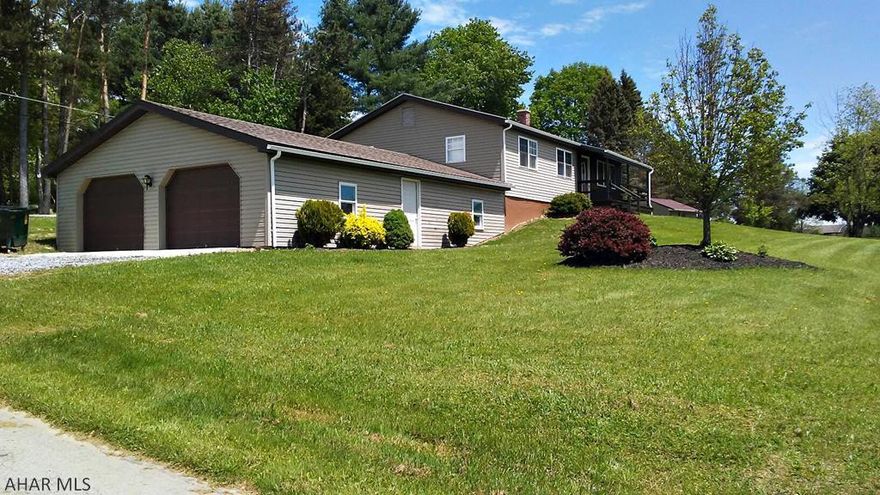 The Quiet Country Life is the feature of this Lovely one story home on a corner lot. Move right in to this newly updated home that offers a Country Kitchen with Breakfast Bar, Dining area off kitchen with french doors leading out to the back deck, Large Living Room and 3 Spacious Bedrooms. Master Bedroom has an updated half Bath. With it's Fresh Paint and New Flooring this house is "Family Ready" or One Story "Retirement Ready". The Full Basement with high ceilings can easily be finished to your owns specs. 28'x40' 2 Car Garage! Relax on the front porch and enjoy the beautiful & peaceful front yard and watch the sunset. Lasting memories start here! Call for your Private Showing.