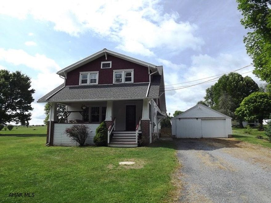 Very nice flat lot. Yard is partially fenced. Much character in this 1929 2-story home w/ large and open main floor. One enclosed porch! Minute to Chestnut Ridge Schools. Detached 2 car garage.