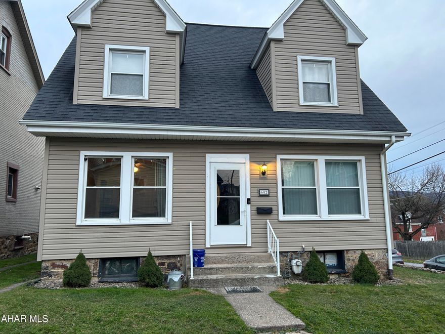 Cute 3 Bedroom 2 Bath Cape Cod Style home located on a corner lot and only one block from Juniata  Elementary School and walking distance to the school playground. Large Enclosed Front Porch and also a Nice Rear Covered Back Porch ,Updated Newer Vinyl  Flooring on 1st floor and Hardwood floors on the 2nd floor and a updated 1/2 bath on main floor .There is a Garage and Storage Shed also ,There is Heat and Electric in the Attic which could be used as a possible 4th Bedroom.Seller has a house under contract and will close Mid December.
