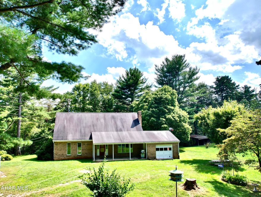 I caught you looking at this SWEET home nestled in the hills of Clearville, PA.  Hard to find stick-built brick home with approximate 7 acres.  Wonderful home with 4 spacious bedrooms, 2 full baths.  Plenty of living area including a large living room flowing into the dining room and kitchen. Beautiful hardwood floors throughout.  Enjoy the BEAUTIFUL views and garden.  Multiple outside storage/workshops.  A frame building was once used as weekend getaway. make it your own!!
