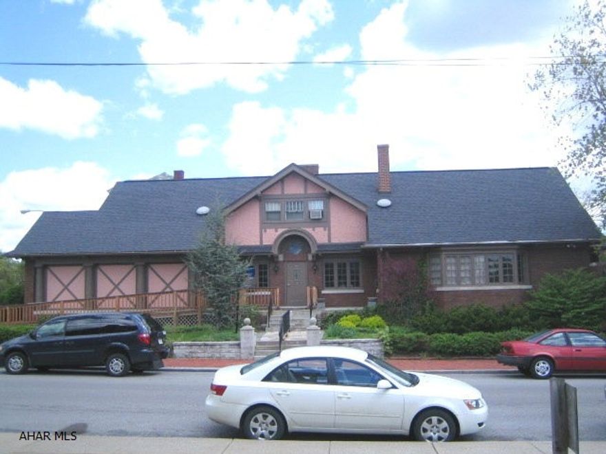 Professional brick office building. Approx. 3,500 sq ft with 8 nicely appointed office spaces, 2 kitchenettes, large waiting area, 2 full baths, attached garage with opener, & semi-finished basement. Updated mechanics, handicapped ramp, brick exterior, & busy location. Work downstairs and live upstairs by easily converting 2nd floor office area into apartment.