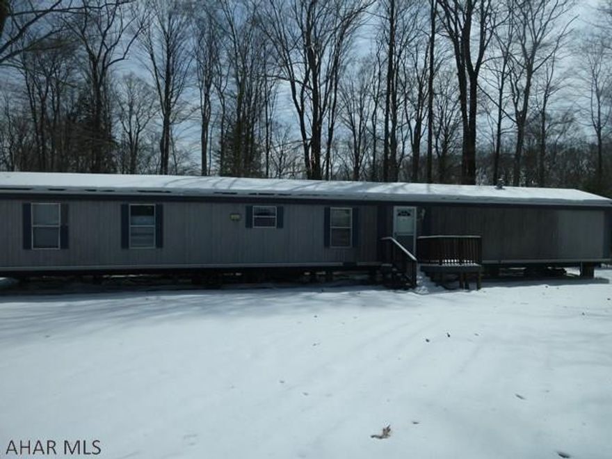 Roomy three bedroom, two bath mobile home with shed on one-third acre lot.  Master bedroom with bath on one end for privacy.  Kitchen has lots of counter space including a bar for extra seating.  Two additional bedrooms with second bathroom located between the two.  Located in Glendale Yearound, a gated community with recreational amenities adjacent to Prince Gallitzin State Park / Glendale Lake.  Six miles from Rock Run ATV park.     Owner may finance to the right buyer.