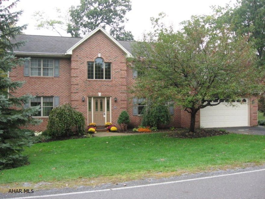 WOW! This home has it ALL - Conveniently located between Alt/Hlbg. Low Taxes (Logan Township)Beautiful wooded lot with pond, fire pit,playhouse and swingset. Spacious kit. opens into the family rm. Mastersuite with Jacuzzi plus shower stall. Totally finished walk-out basement  with 3/4 bath.  Finished garage with addit. area  for riding mower. 2 furnaces & air c. Tremendous value.