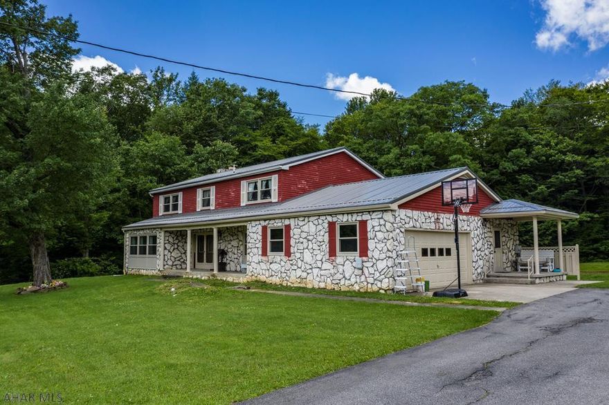 5 bedroom 3 1/2 bathroom home on 2.2 acres. This home has spacious bedrooms throughout. Also features Window World windows with a lifetime transferable warranty. Backyard boasts privacy surrounded by woods and with a brick fireplace for cookouts and get togethers.  Huge back patio to kick off your shoes and admire nature. 2 pellet stoves to heat the home in case you want to cut your oil costs. Plenty of storage in the basement or attic. 2 car garage so you dont have to go outside to start your vehicle in the winter time. Brand new Metal roof.  Sewer recently updated.  This home is a must see.