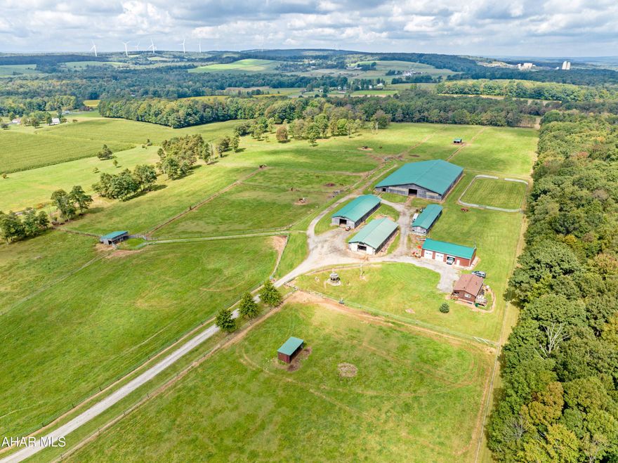 As you drive up the gated driveway, you will find yourself lost in the never ending views that surround the property.  Offers 38+acres, a newer 2BR, 1BA home, grooms apartment and so much more! 3 barns, an outdoor riding arena, a storage building with second floor, run-in pasture sheds, a time saving hot walker and brand new, metal sided 60 x 36 garage make this a horse lover's dream! The crowning jewel of this property is the120 x 200 indoor riding arena with run shoots for cattle. The arena features brand new LED lighting.  The property has a history of hosting reining and other ranch futurities/events/clinics which adds to the many diverse ways you can make this property pay for itself!  The income generation possibilities are endless, being located between major horse race tracks and vet clinics with a nice demand for boarding facilities. All of the barns and sheds have newer metal roofs, electric, and water. The main barn has brand new individual infrared radiant heat lights for the comfort of horses and people. The property offers 34 stalls including  breeding/foaling stalls and 3 walk-in sheds - each with a new roof & water supplies.  The property is enrolled in Clean and Green which has reduced the total property taxes to only $1589 per year!! 
 Where else could you purchase 38+ acres with all of these buildings in a Township with NO ZONING with taxes of just $1,589!?? Income POTENTIAL is endless!  History of $450/month per horse for stall board + $400 for outdoor kept horse + rental of indoor arena + possible apartment rent...add it up!!  Local hay delivery, very affordable electric costs.
 Just 3 miles from the Flight 93 Memorial and a large ATV park.  Qualified buyers only.