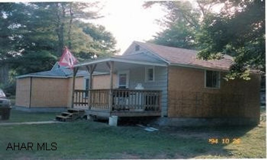 1 story vacation or year round property. 2BR/1BA, large living room with sliding glass doors.