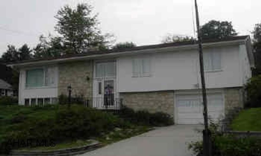 Well built home.  Nice lot, large workshop shed, hot tub in basement, 2 sided fireplace in living room and kitchen.