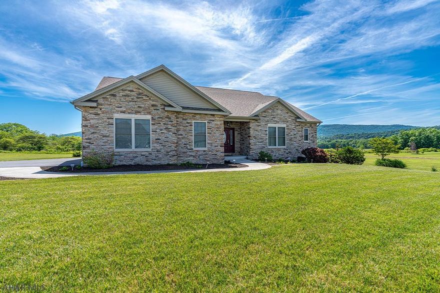 Beautiful, bright and sunny.....3 good words to describe this home!  Gently lived in house on over 4 acres of land.  2-3 bedrooms, 2 baths, a first floor laundry and a 3 car garage make for easy living .Kitchen has a large Granite island, plenty of storage and appliances stay.  The sun room is a delight year round...always cheerful, plus there is a hose bib for watering all of your plants...brilliant.  Outside you'll enjoy the spacious patio overlooking the mountains....the garden is large and fenced...added bonus, there is a separate large shed/garage for supplies. The basement is ready to be finished, already plumbed for a bath.  Great location...close to everything, yet tucked away.