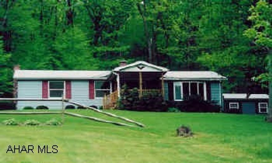 Nicely landscaped with 2.1 acres. Lovely rancher with 2 car detached garage.