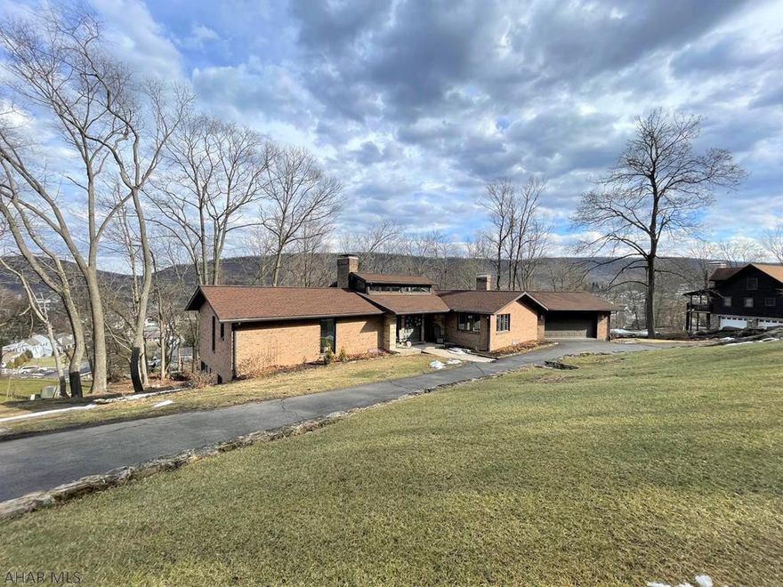 Spacious and captivating contemporary home overlooking Bedford!! Super location with town & mountain views!! Double door entry foyer; great room w/ cathedral ceiling, stone FP; DR with deck access; kitchen w/ quartz counters, island & large breakfast nook; two bedrooms; & a full bath. Lower lower has a family room w/ brick FP; master suite with m. bath and walk-in closets; an additional bedroom; full bath & bonus room for a guest quarters or possible in-law suite. Windows abound in this home, custom features throughout, recessed lights, & hardwood floors. Natural gas heat with central air conditioning. Two-car insulated and finished garage, black-top driveway & stone retaining wall. Beautiful home & perfect for entertaining. Easy access to the downtown area & major roads.