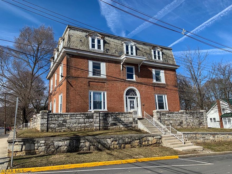 9-unit brick apartment building located in downtown Bedford. Water, sewer, electric, and heat is all separated. .35 acre lot with off-street parking that can be expanded for additional parking.
